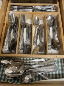 Open drawer filled with silverware.